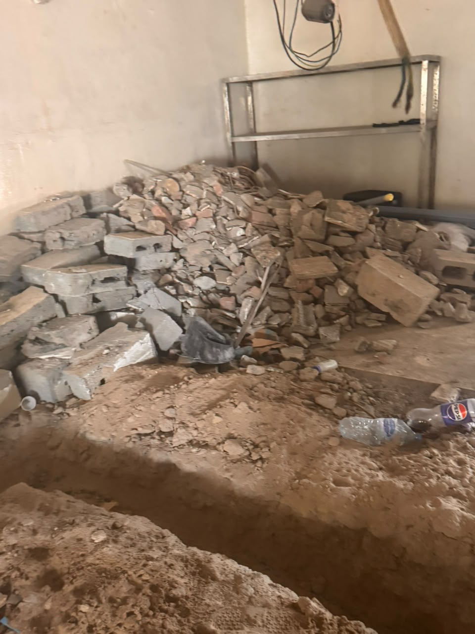 Broken blocks and rubble piled for collection
